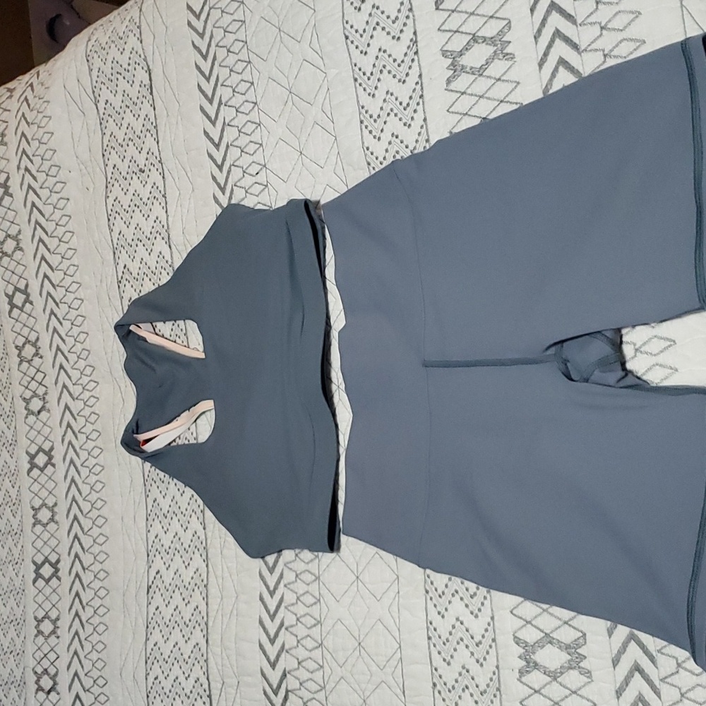 NWOT Fabletics outfit, size small. Blue and colorful decorative straps on back.